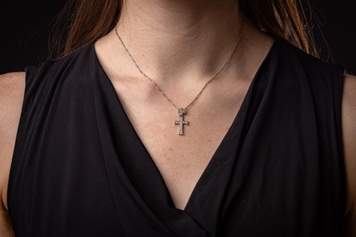 Lot 227 - Dior - a diamond-set double cross pendant on...