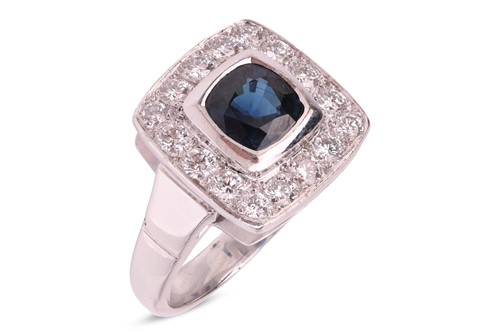 Lot 167 - A sapphire and diamond cluster ring in 18ct...