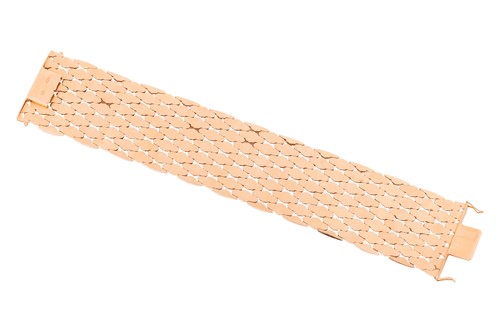Lot 294 - A wide fancy link bracelet, comprising a...