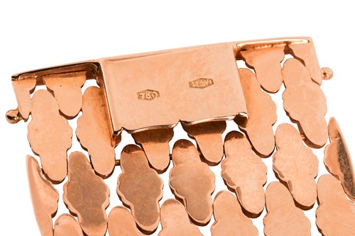 Lot 294 - A wide fancy link bracelet, comprising a...