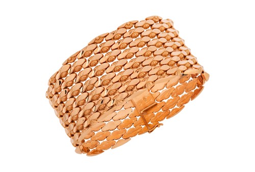 Lot 294 - A wide fancy link bracelet, comprising a...