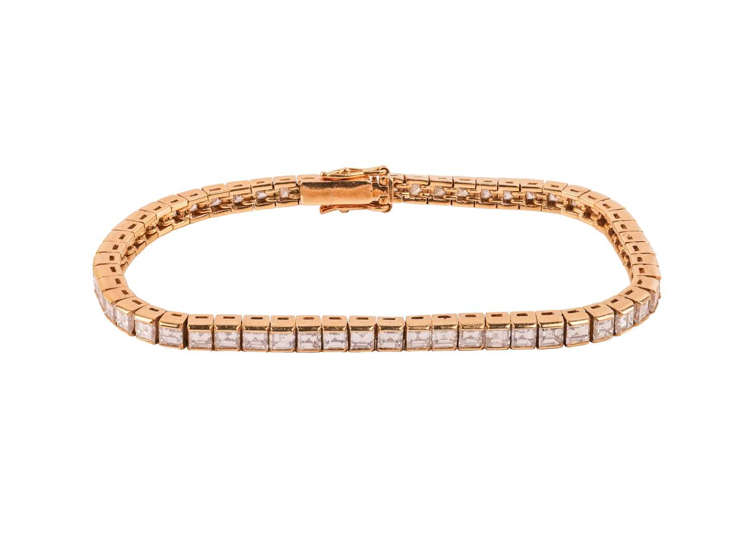 Lot 252 - A diamond line bracelet, with an estimated...