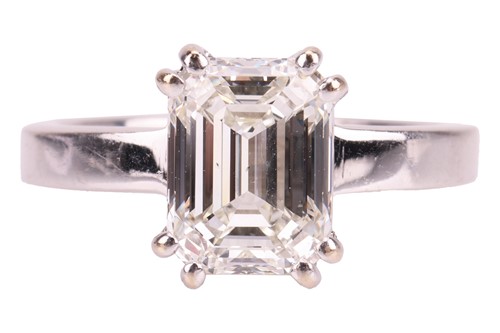Lot 300 - A single stone emerald-cut diamond ring, the...