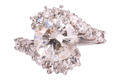 Lot 109 - A diamond-set crossover-style ring, featuring...