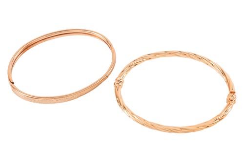 Lot 102 - Two 9ct gold hinged bangles; to include a...