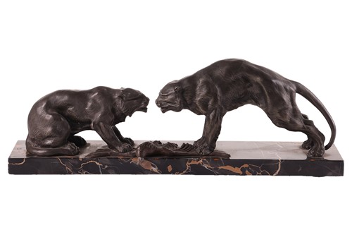 Lot 142 - A large Art Deco spelter study of two big cats,...