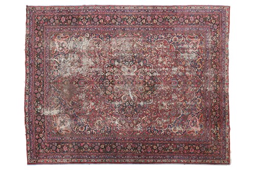 Lot 75 - A "country house" Kerman carpet with a...