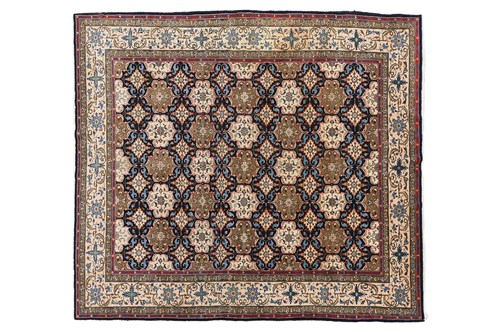 Lot 74 - An ivory-ground Isfahan carpet with a...