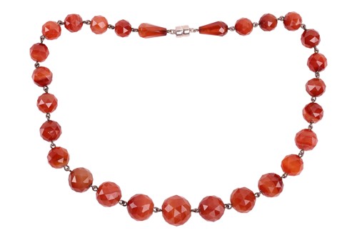 Lot 60 - A carnelian bead necklace, comprising an array...