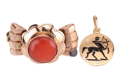 Lot 62 - A coral brooch and a sagittarius enamel charm;...