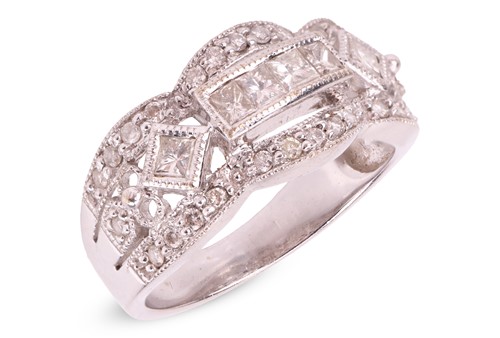 Lot 106 - An Art Deco style diamond-set ring, centrally...