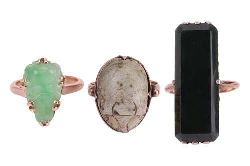 Lot 15 - Three gem-set rings; to include an elongated...