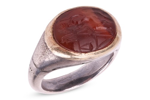 Lot 322 - A Roman carnelian intaglio ring, the oval...