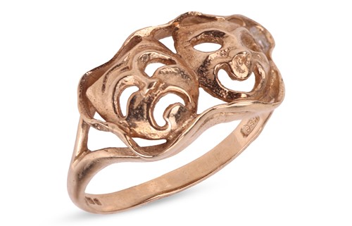 Lot 27 - A 9ct yellow gold comedy and tragedy mask ring,...