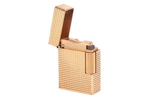 Lot 143 - An S.T. Dupont gold-plated lighter with...