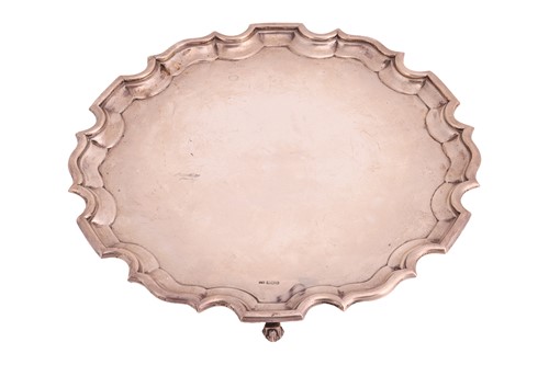 Lot 411 - An early 20th century silver salver; circular...