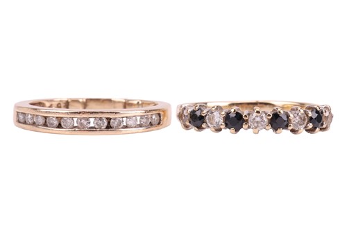 Lot 110 - Two rings; comprising a diamond channel-set...