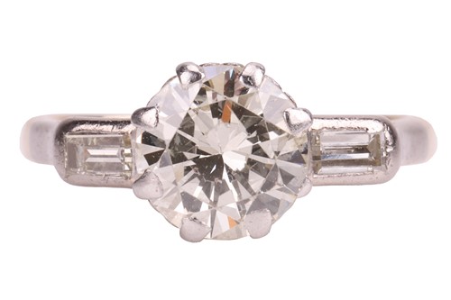 Lot 47 - A diamond solitaire ring, the central diamond...
