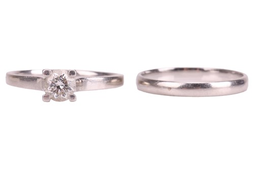 Lot 163 - A diamond solitaire ring and a band ring, the...