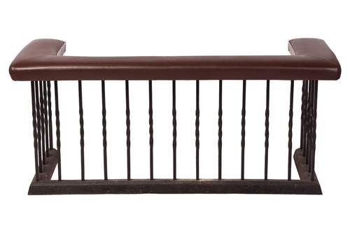 Lot 28 - A club fender, iron frame with brown cushioned...