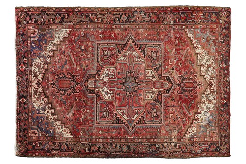 Lot 78 - A Heriz carpet, with central medallion and...