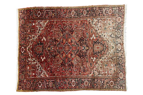 Lot 76 - A Heriz carpet, with central geometric lozenge,...