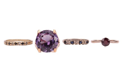 Lot 107 - Four gem-set rings; to include a synthetic...