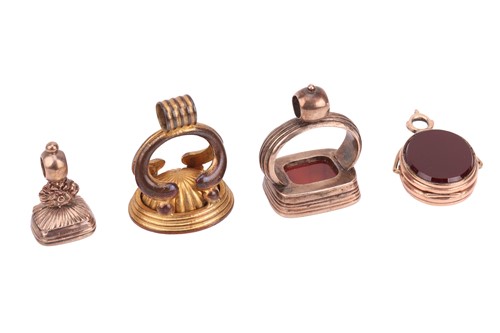 Lot 325 - A pink metal swivel seal cum locket, set to...