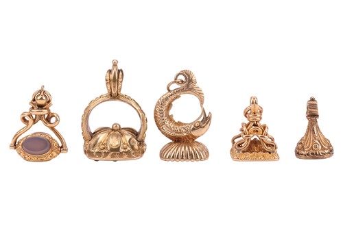 Lot 324 - Five yellow metal seals; including a rose...
