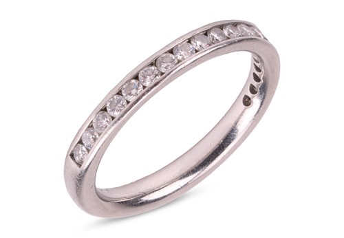 Lot 114 - A diamond-set half-eternity ring, featuring a...