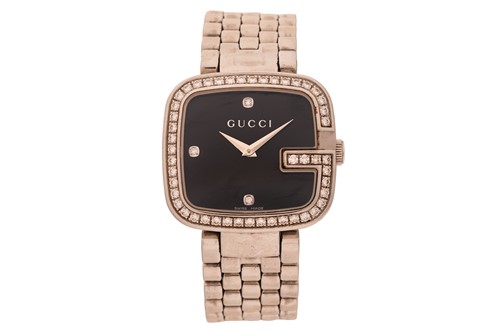 Lot 128 - Gucci – A Diamond-set ‘G’ Wristwatch Reference:...