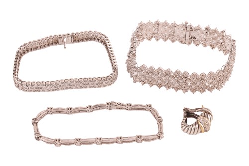 Lot 66 - A group of three diamond-set bracelets and a...
