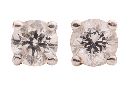 Lot 290 - A pair of diamond stud earrings, each claw-set...