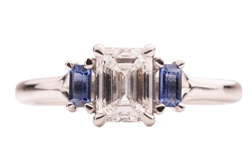 Lot 296 - A diamond and sapphire trilogy ring, featuring...