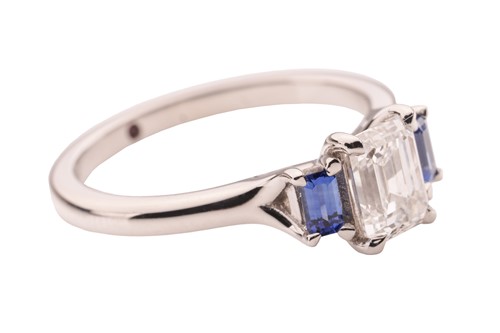 Lot 296 - A diamond and sapphire trilogy ring, featuring...