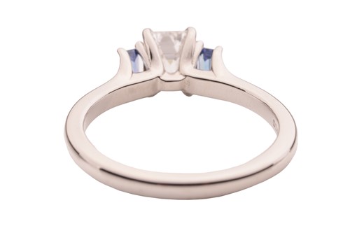 Lot 296 - A diamond and sapphire trilogy ring, featuring...