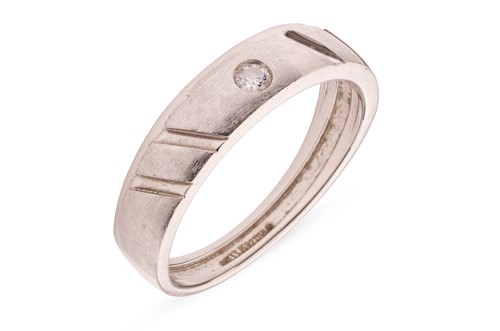 Lot 189 - A diamond-set band, featuring a gypsy-set...