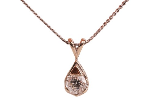 Lot 161 - A diamond-set solitaire pendant, claw-set with...