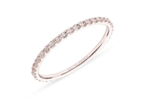 Lot 171 - A diamond eternity ring, featuring forty round...