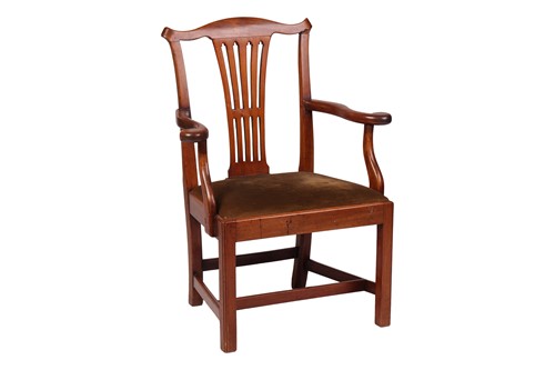 Lot 23 - A George III walnut provincial open armchair...