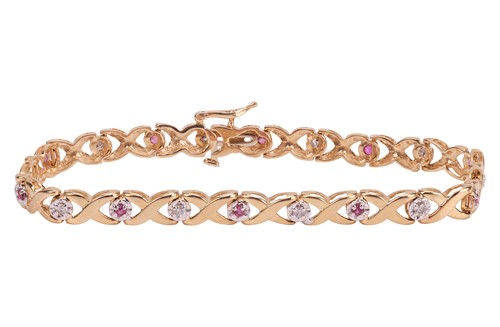 Lot 146 - A gem-set floral bracelet, the crossover links...