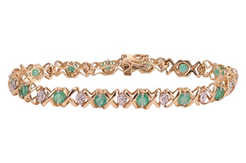 Lot 137 - An emerald line bracelet, comprising fourteen...