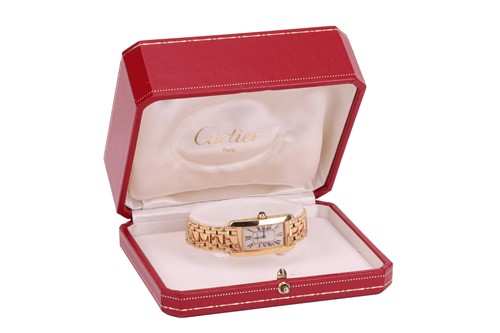 Lot 201 - Cartier – An ‘18K’ Tank Americaine Wristwatch...