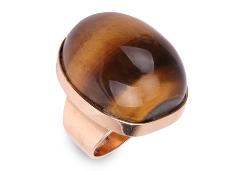 Lot 83 - A tiger's eye pinky ring, featuring a large...