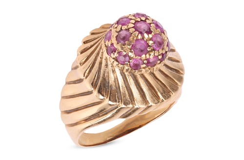 Lot 68 - A ruby-set dress ring, featuring a central...