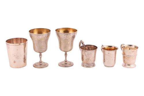 Lot 408 - A group of silver and white metal beakers,...
