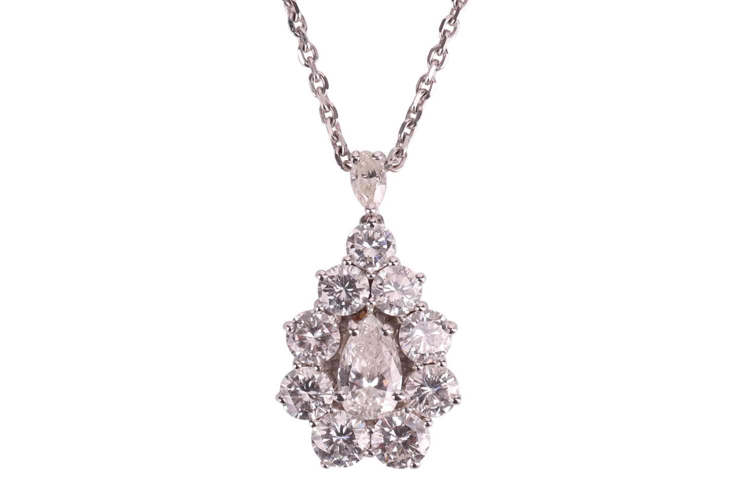 Lot 295 - A diamond cluster pendant on chain, with an...