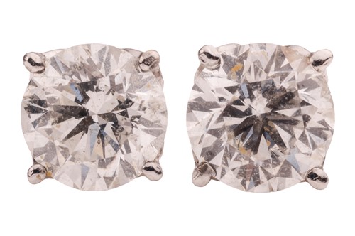Lot 102 - A pair of diamond stud earrings, each earring...