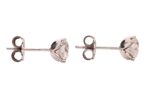 Lot 102 - A pair of diamond stud earrings, each earring...