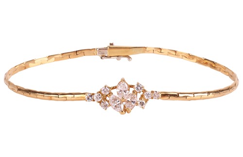 Lot 83 - A diamond-set bracelet, composed of a central...